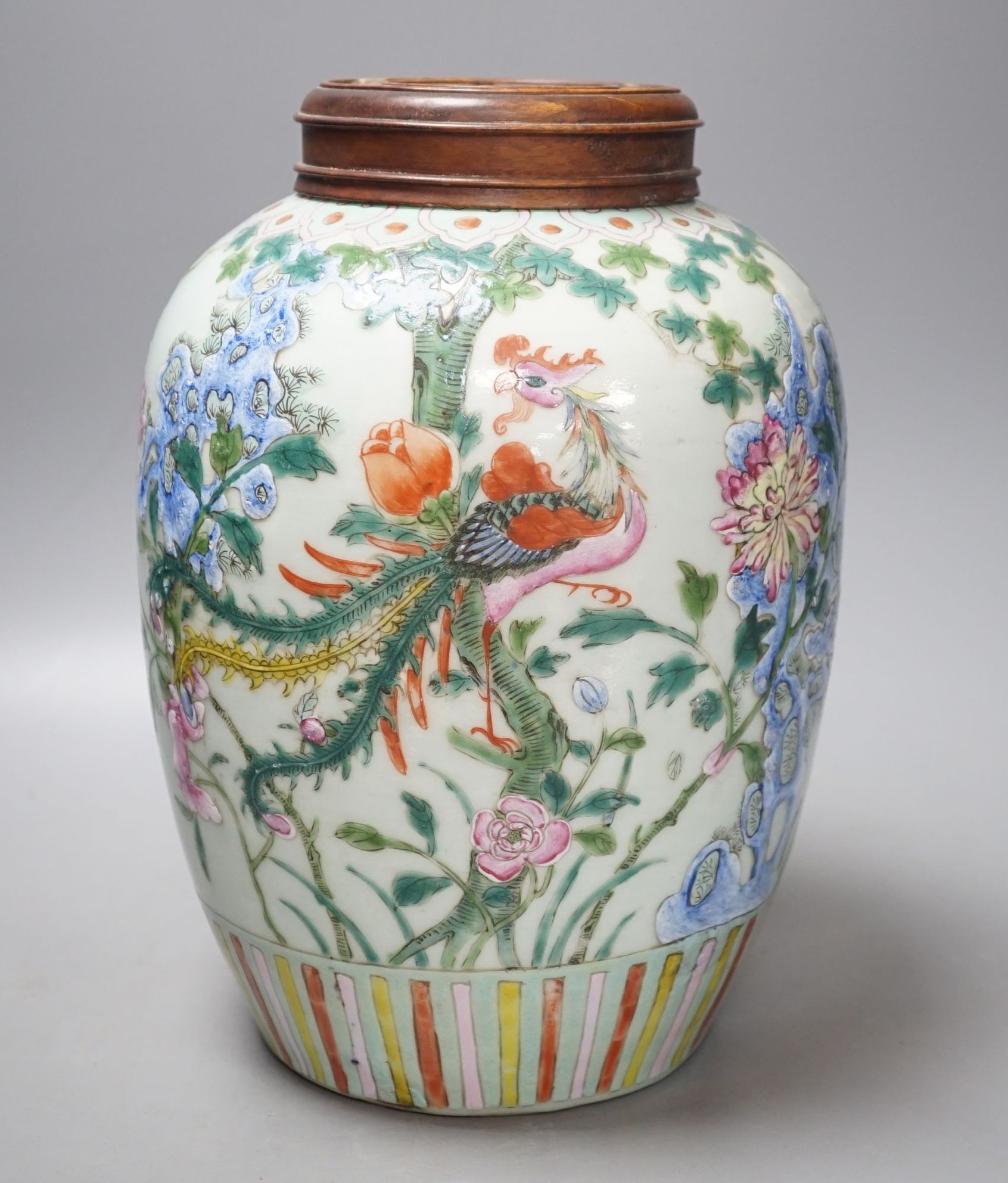 A Chinese Straits famille rose ‘phoenix’ jar and Hongmu cover, 30 cms high including cover.